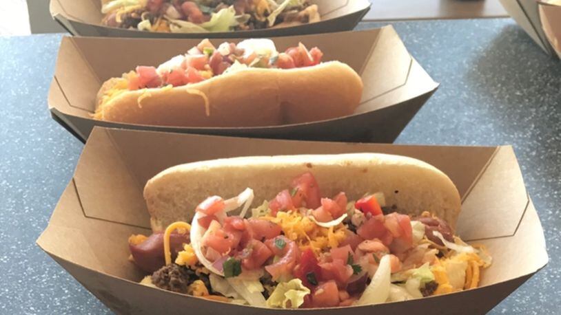 The Taco Dog: oozing with beef, cheddar, lettuce, pice de gallow and hot sauce, available in Great American Ball Park’s Porkopolis section. PHOTO: LIBBY CUNNINGHAM, WCPO.
