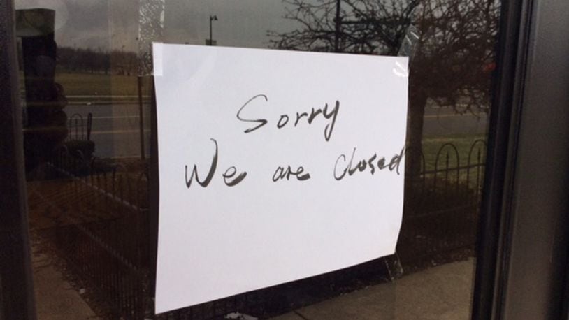 A hand-lettered sign reading “Sorry We are Closed” is taped to the front door of the Osaka Sushi & Hibachi Buffet restaurant at 8901 Kingsridge Drive behind the Dayton Mall. MARK FISHER/STAFF