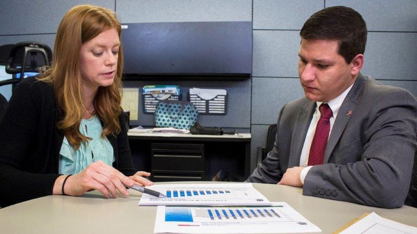Matthew Moore (right) receives inputs on a document from his supervisor, Stephanie Hilgeford, working capital fund chief, Sept. 17 at Air Force Materiel Command, Wright-Patterson Air Force Base. Moore is considered disabled with dyslexia and ADHD. He secured in internship earlier in the year through AFMC’s Workforce Recruitment Program, which has since lead to a permanent position at Wright-Patterson. (U.S. Air Force photos/Jim Varhegyi)