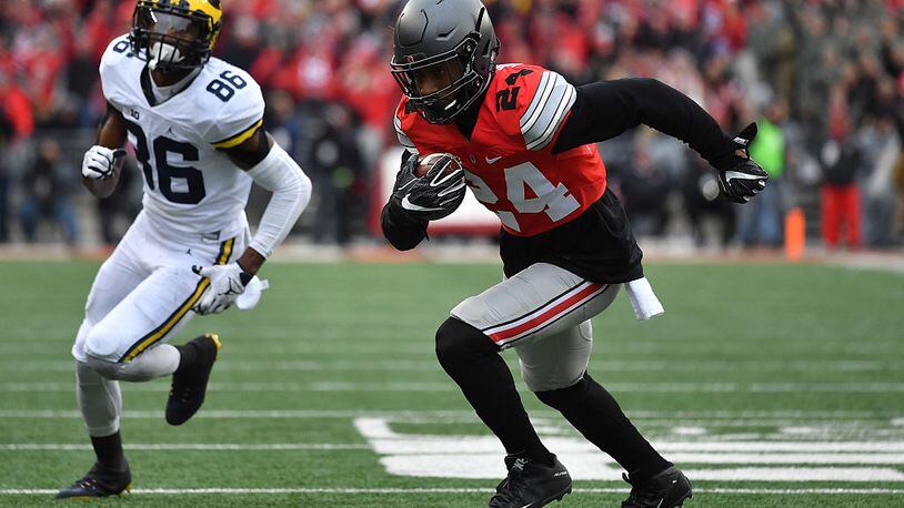 COLUMBUS, OH - NOVEMBER 26: Malik Hooker #24 of the Ohio State Buckeyes runs for a touchdown after intercepting a pass by Wilton Speight #3 (not pictured) of the Michigan Wolverines during the first half of their game at Ohio Stadium on November 26, 2016 in Columbus, Ohio. (Photo by Jamie Sabau/Getty Images)