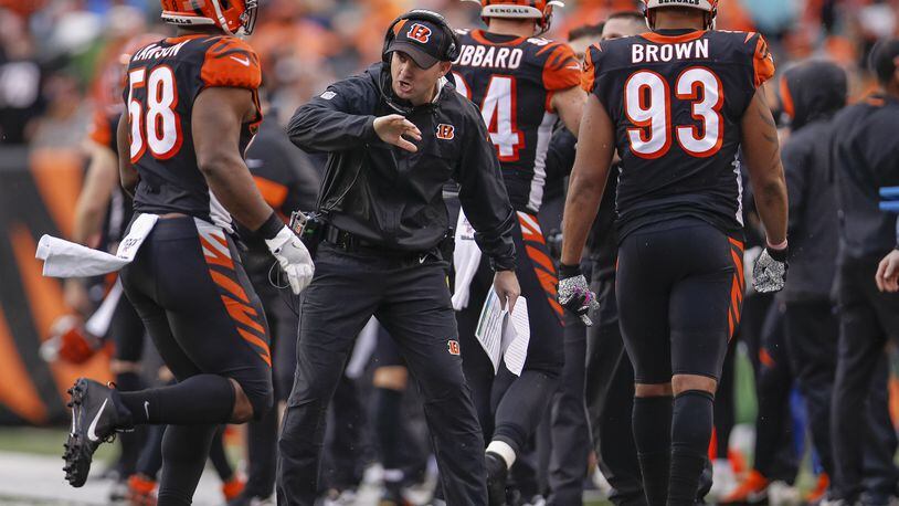 CINCINNATI, OH - DECEMBER 29: Head coach Zac Taylor celebrates with Carl Lawson #58 of the Cincinnati Bengals during the second half against the Cleveland Browns at Paul Brown Stadium on December 29, 2019 in Cincinnati, Ohio. (Photo by Michael Hickey/Getty Images)