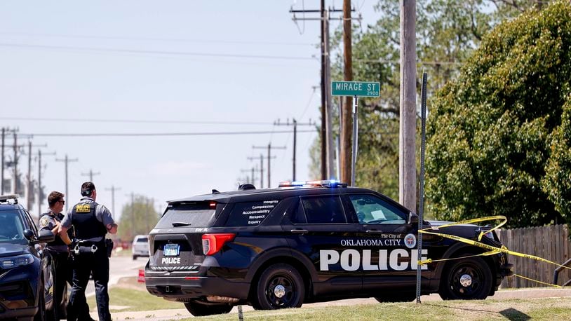 Police investigate after people were found dead in a home in Oklahoma City on Monday, April 22, 2024. Oklahoma City police called to a home on the city's southwest side Monday discovered the bodies of five people, including at least two children, authorities said. (Nathan J. Fish/The Oklahoman via AP)