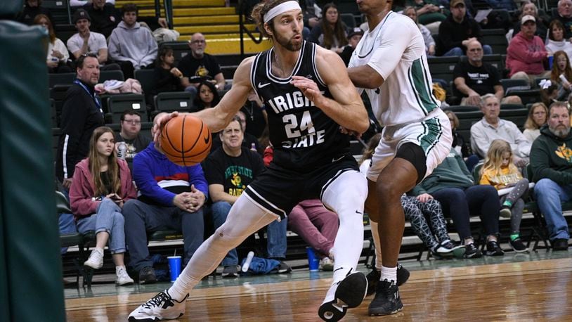 Wright State's Tim Finke drives baseline past a Green Bay player during Saturday night's game at the Nutter Center. Wright State Athletics photo