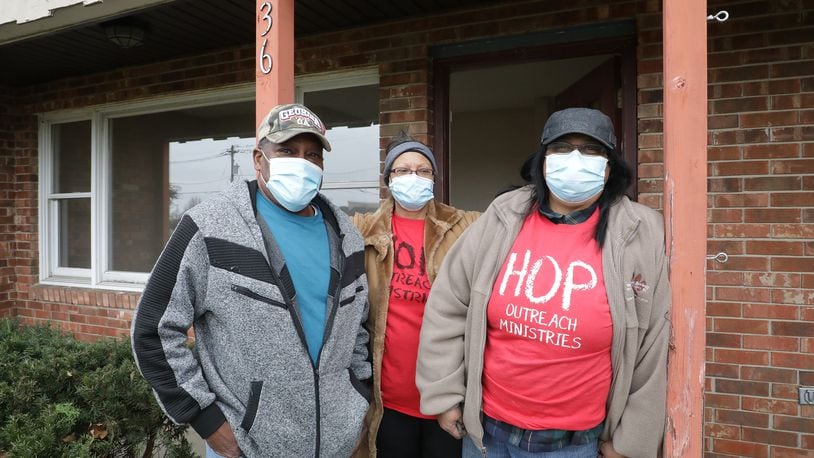 Alonzo McCoy, Edith Davis, center, and Michelle Speaks from the HOP Outreach Ministries, in front of the building that was donated to their food pantry for the winter. The building was donated by Dr. John Bruce of the Northwood Animal Hospital. BILL LACKEY/STAFF