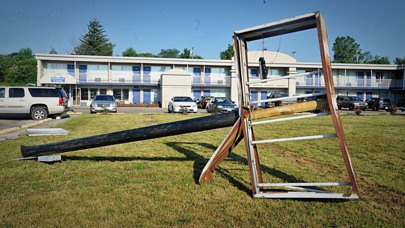 A woman died after she was shot by police and crashed a stolen truck into a sign at the Days Inn on Miller Lane Sunday, July 12, 2020, in Butler Twp. STAFF PHOTO / MARSHALL GORBY