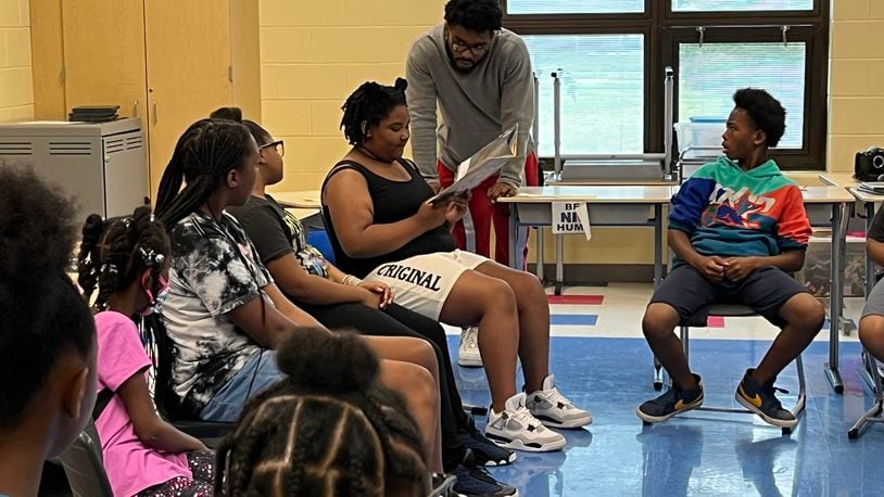 Students at Camp H.O.P.E. take turns reading a book related to their weekly theme. Camp H.O.P.E. is run by Omega CDC at Fairview Elementary and Edwin Joel Brown Middle School.