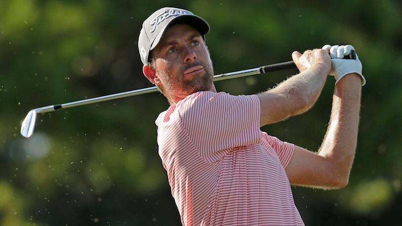 Webb Simpson watches his tee shot on the 16th hole during the third round of the Wyndham Championship golf tournament in Greensboro, N.C., Saturday, Aug. 19, 2017. (AP Photo/Chuck Burton)