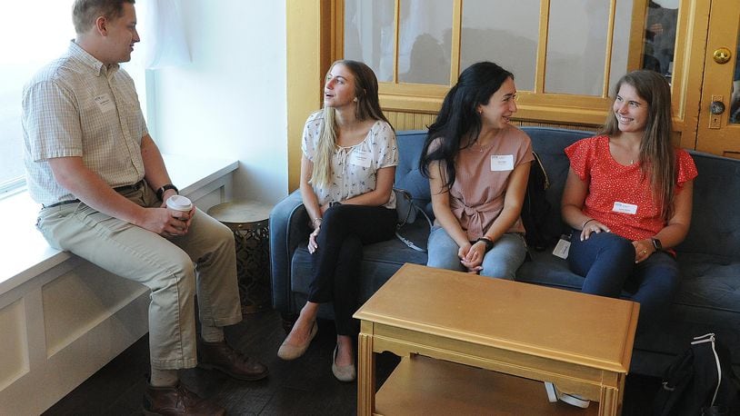 Enjoying the mixer for Young Professionals at Reza's Downtown Cafe on Thursday, July 21, 2021, from left, Nick Miller-Jacobson, Lauren Shuman, Nour Saleh and Sophie Walther. MARSHALL GORBY\STAFF