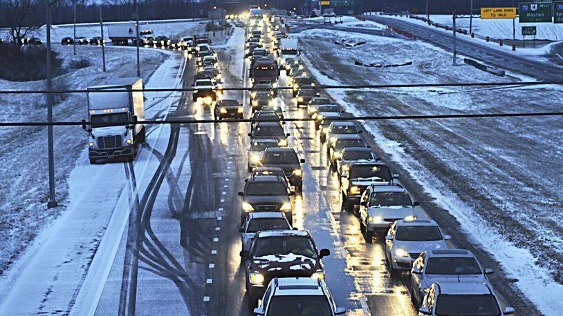 Drivers were at a standstill on Interstate 675 southbound near Interstate 70 Thursday after an early-morning snow burst caused whiteout conditions and slick highways across the region and contributed to three fatalities in the area. MARSHALL GORBY / STAFF