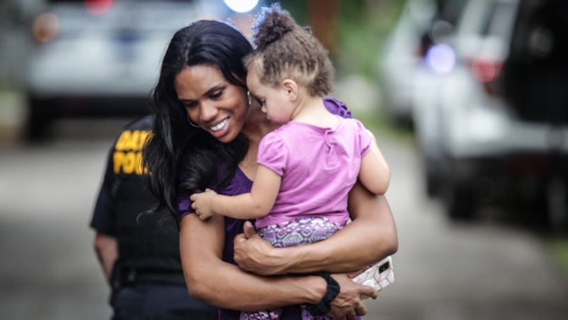 Razshae Wood smiles after being reunited with her daughter, Haleigh Wood. The 2-year-old was with her father who momentarily left her sleeping in her car seat in the back of a car at a Dayton gas station when it was stolen. An Amazon delivery driver found the girl on the side of a street in Harrison Twp. still strapped in her car seat. JIM NOELKER/STAFF