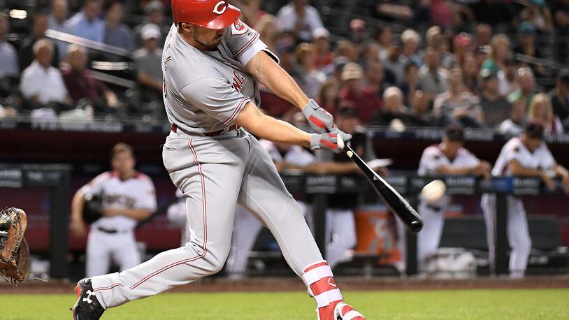 PHOENIX, AZ - MAY 30: Adam Duvall #23 of the Cincinnati Reds hits a grand slam in the fourth inning of the MLB game against the Arizona Diamondbacks at Chase Field on May 30, 2018 in Phoenix, Arizona. (Photo by Jennifer Stewart/Getty Images)
