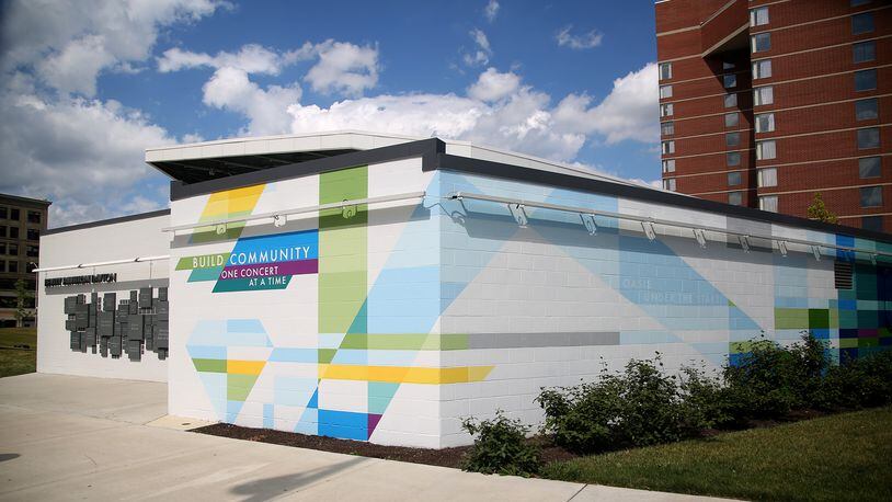 MixedA new mural, with poetry written by Sierra Leone,  has been completed at the Levitt Pavilion in Dayton. The poem, “Music Heals on Fifth and Main,” can be read in full on the north side of the building located east of the pavilion. The mural, a combination of bold shapes and bright colors, was designed by Brent Beck and executed by Atalie Gagnet, two local artists.   LISA POWELL / STAFF