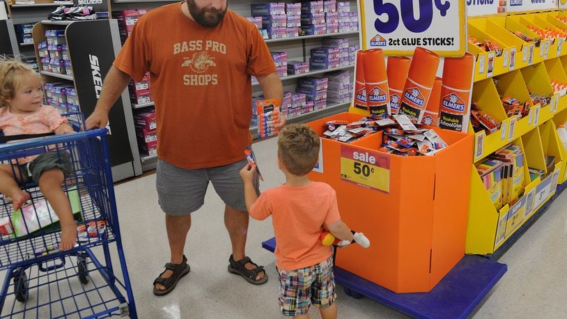 Mark Gunton with his childern Monica and Drew was shopping for school supplies at the Meijer Store on Wilmington Pike on Friday, July 30, 2021. MARSHALL GORBY\STAFF