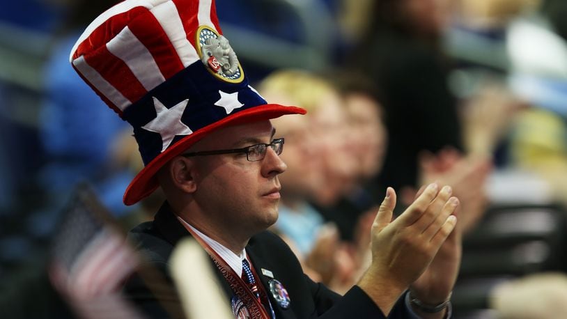 TAMPA, FL - AUGUST 29: A man wearing an American flag hat claps during the third day of the Republican National Convention at the Tampa Bay Times Forum on August 29, 2012 in Tampa, Florida. Former Massachusetts Gov.Mitt Romney was nominated as the Republican presidential candidate during the RNC, which is scheduled to conclude August 30. (Photo by Mark Wilson/Getty Images)