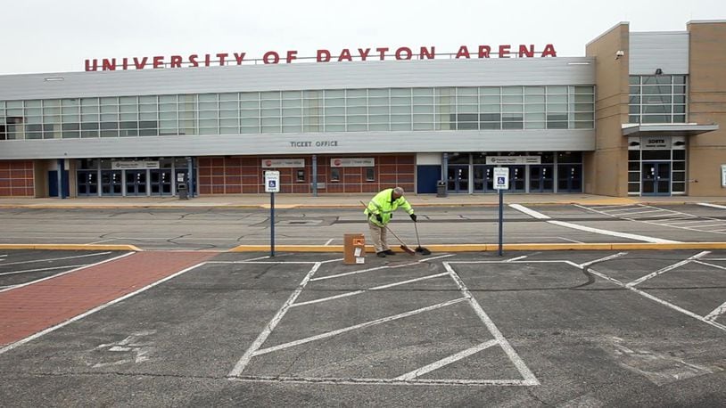 Gene Jarman made a final sweep of the parking lot at UD Arena before the team practices on Monday evening for the NCAA First Four.  TY GREENLEES / STAFF