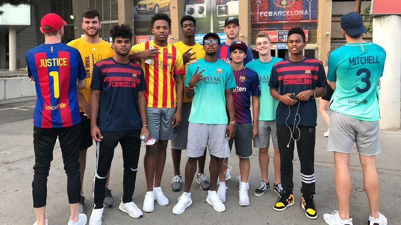 In this image taken Aug. 7, 2017, and provided by Arizona State University, members of Arizona Stateâs menâs basketball team pose outside of FC Barcelonaâs  Camp Nou stadium in Barcelona, Spain. College basketball teams are allowed foreign trips once every four years and the Sun Devils went to Rome and Barcelona during a nine-day trip. (Arizona State University via AP)