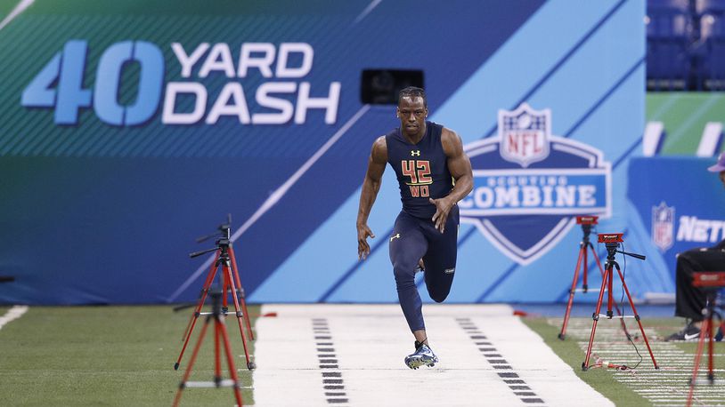 INDIANAPOLIS, IN - MARCH 04: Wide receiver John Ross of Washington runs the 40-yard dash in an unofficial record time of 4.22 seconds during day four of the NFL Combine at Lucas Oil Stadium on March 4, 2017 in Indianapolis, Indiana. (Photo by Joe Robbins/Getty Images)