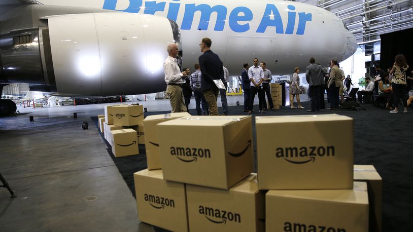 Amazon.com boxes are shown stacked near a Boeing 767 Amazon “Prime Air” cargo plane on display in August 2016 in a Boeing hangar in Seattle. AP Photo/Ted S. Warren