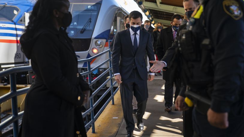 Transportation Secretary Pete Buttigieg walks from a train platform after visiting with Amtrak workers at Union Station in Washington, Friday, Feb. 5, 2021. (AP Photo/Carolyn Kaster)