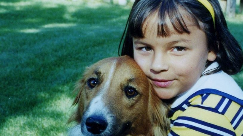 A younger Jordan with her dog, Lucy. KARIN SPICER