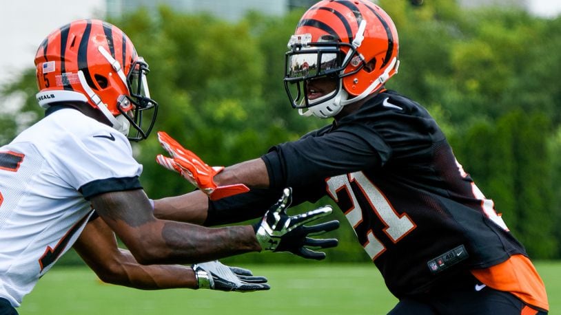Darqueze Dennard, right, defends Mario Alford on the first day of the Cincinnati Bengals training camp on her birthday Friday, July 29 at their practice fields near Paul Brown Stadium in Cincinnati. NICK GRAHAM/STAFF