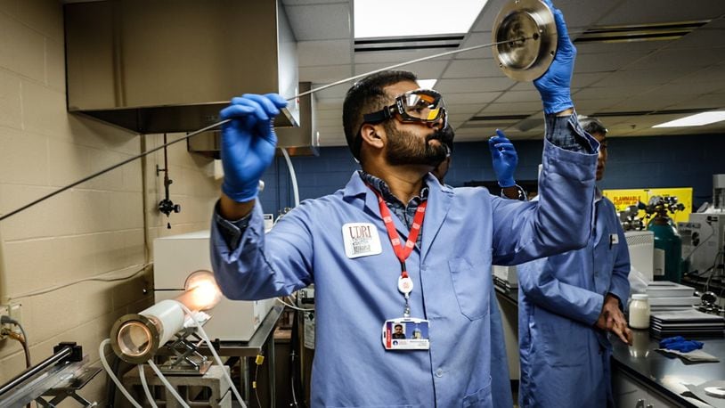 University of Dayton chemical engineering grad student, Muhammad Qasim Ali prepares the PFAS incinerator at the research Insititute. Students and faculty are working on way to eliminate PFAS from the environment. JIM NOELKER/STAFF