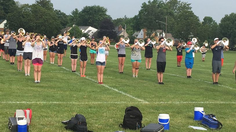 Fairmont High School band members participate in a summer practice on the fields outside the school, preparing for their fall competition season. JEREMY P. KELLEY / STAFF