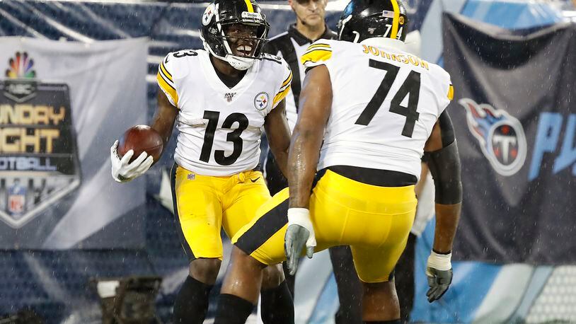 NASHVILLE, TENNESSEE - AUGUST 25: James Washington #13 of the Pittsburgh Steelers is congratulated by teammate Fred Johnson #74 after making a touchdown reception against the Tennessee Titans during the first half of a preseason game at Nissan Stadium on August 25, 2019 in Nashville, Tennessee. (Photo by Frederick Breedon/Getty Images)