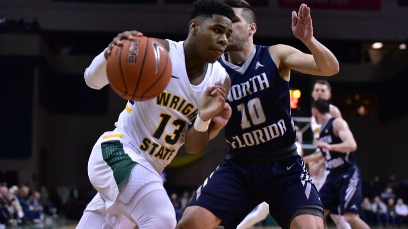 Wright State’s Malachi Smith tries to drive past North Florida’s Ivan Gandia-Rosa during Saturday’s game at the Nutter Center. Joseph Craven/CONTRIBUTED