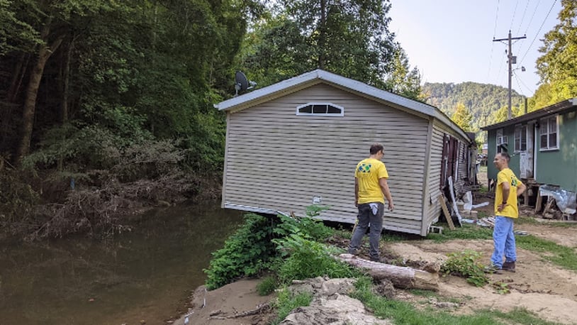 Volunteers from The Church of Jesus Christ of Latter-day Saints in the Dayton area traveled to eastern Kentucky to help flood victims clean their homes and remove trees, debris and furniture. Photo courtesy The Church of Jesus Christ of Latter-day Saints.