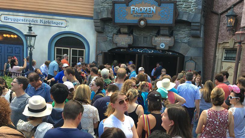 Epcot visitors gather near the entrance of Frozen Ever After, which opened to the public on June 21, 2016. The water boat ride has generated more calls for evacuations to Disney&apos;s fire department than any other attraction over the past two years.  (Dewayne Bevil/Orlando Sentinel/TNS)