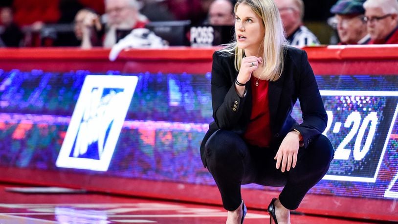 Miami women's basketball coach Megan Duffy kneels on the sideline during their 69-56 loss to Duquesne in their first round Women's NIT tournament basketball game Thursday, March 15 at Millett Hall on Miami University campus in Oxford. NICK GRAHAM/STAFF