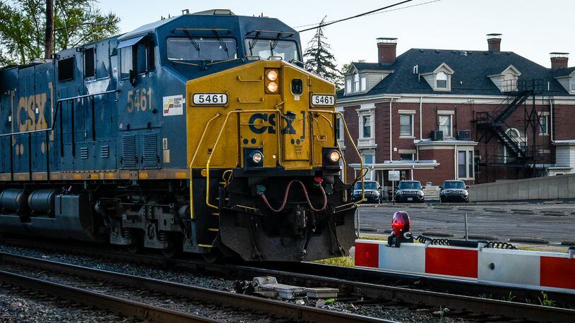 A CSX train rolls down the tracks along N 5th Street at the Butler Street crossing in Hamilton Friday, April 21. NICK GRAHAM/STAFF