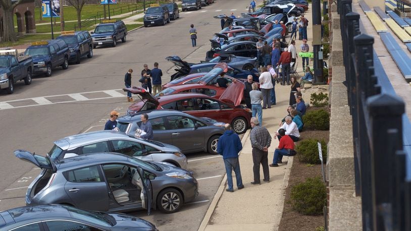 As Oakwood passed an ordinance recently to add $5 to the vehicle tax to pay for street work, Drive Electric Dayton made a pitch to city officials to promote the use of electric vehicles. Pictured is the Earth Day ride in Oakwood.