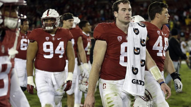 Stanford quarterback Kevin Hogan (8) walks off the field after the 38-36 loss to Oregon in an NCAA college football game Saturday, Nov. 14, 2015, in Stanford, Calif. (AP Photo/Ben Margot)