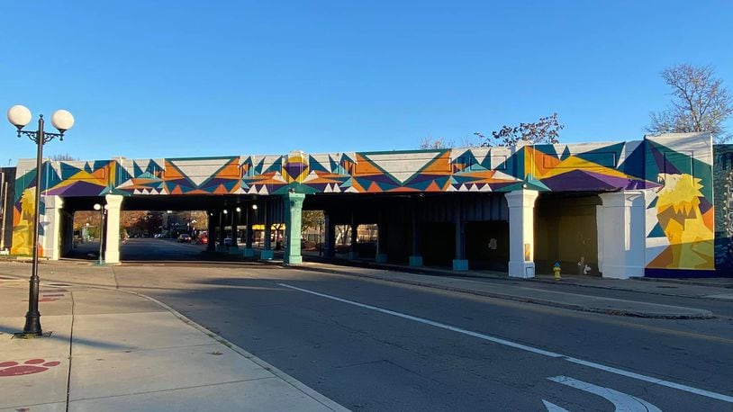 The Oregon District Bridge Mural designed and painted by Dayton native, Dave Scott, alongside muralists B.K Elias, Lydia Williamson, and a host of volunteers has been completed. CONTRIBUTED
