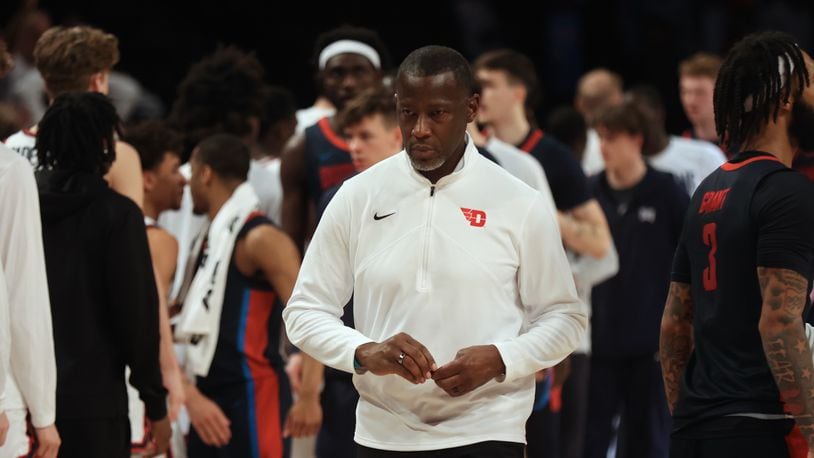 Dayton's Anthony Grant leaves the court after a loss to Duquesne in the Atlantic 10 Conference tournament quarterfinals on Thursday, March 14, 2024, at the Barclays Center in Brooklyn, N.Y. David Jablonski/Staff