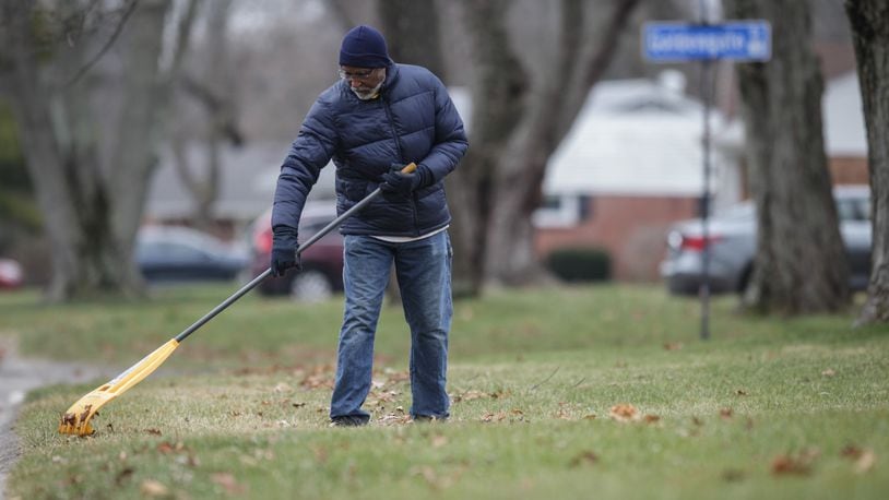 Rev. Wendell Oldham Jr. rakes leaves on his property on Goldengate Dr. in Centerville Monday Jan. 4, 2021. Property  owners will soon receive property tax bill for 2021 in the mail. JIM NOELKER/STAFF