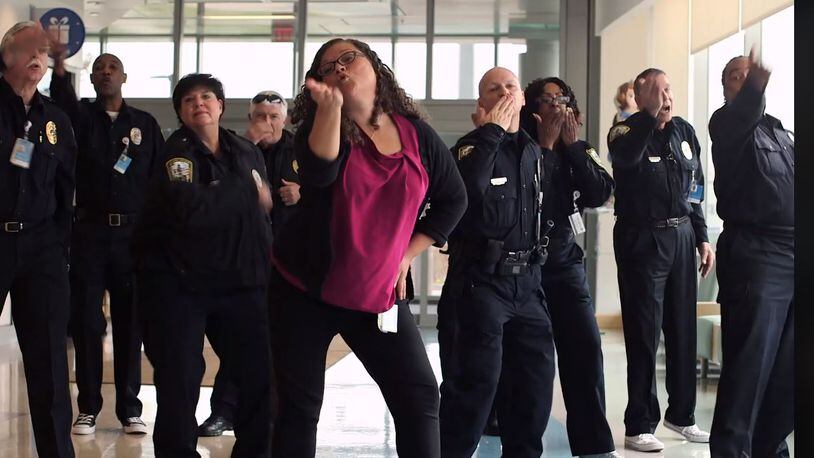 Stacey Adidou, a Cincinnati Children’s senior administrative assistant, leads a dance she choreographed during Cincinnati Children’s Hospital Medical Center’s “Can’t Stop the Healing” Holiday Video.