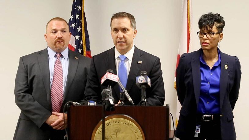 State Attorney Dave Aronberg with chief assistants Brian Fernandes and Adrienne Ellis announce officer Nouman Raja is being charged with one count of manslaughter by culpable negligence and one count of attempted first degree murder with a firearm in the death of Corey Jones in West Palm Beach, Florida on June 1, 2016. (Allen Eyestone / The Palm Beach Post)
