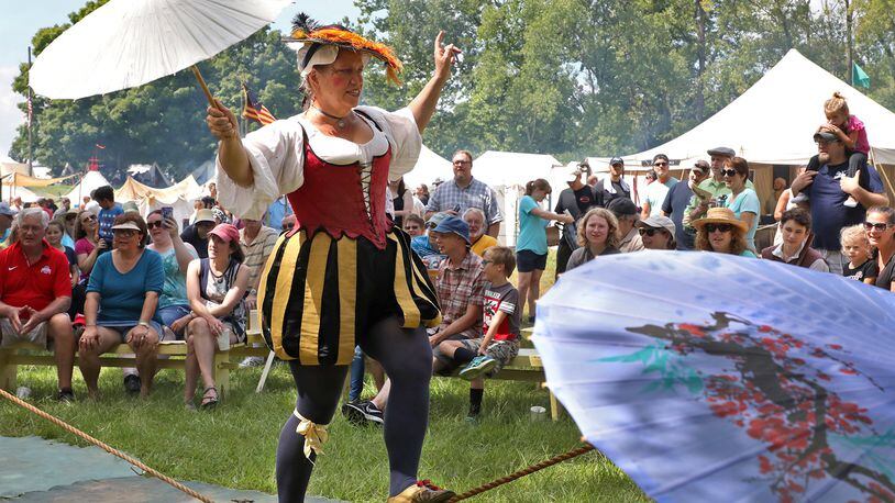 Signora Bella entertains the crowd at the Fair at New Boston by walking on a slack rope during her show in 2018. BILL LACKEY/STAFF