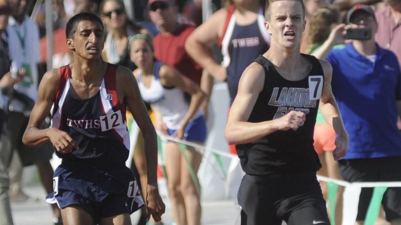 Lakota East’s Dustin Horter (right) retakes the lead and wins the 1,600 meters (4:08.38) during Saturday’s Division I state track and field meet at Ohio State University’s Jesse Owens Memorial Stadium in Columbus. MARC PENDLETON/STAFF