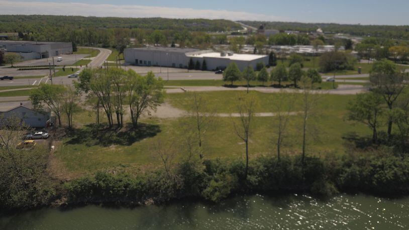 The city of West Carrollton wants to tear down three buildings it owns on the Great Miami River. It wants to hire the same company tearing down the former Carrollton Plaza, seen here in an earlier photo. STAFF