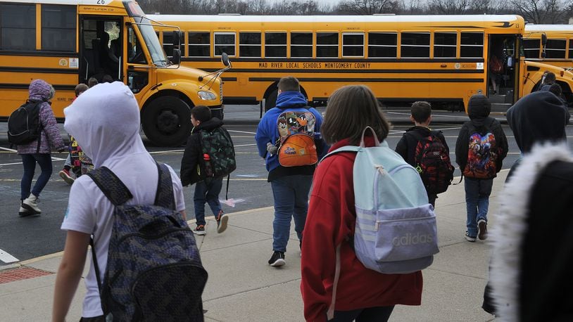 Students at Stevenson Elementary School in the Mad River district head to the buses Friday March 11, 2022. MARSHALL GORBY\STAFF