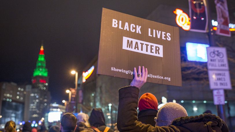 CLEVELAND, OH - DECEMBER 29: Demonstrators march on Ontario St. on December 29, 2015 in Cleveland, Ohio. Protestors took to the street the day after a grand jury declined to indict Cleveland Police officer Timothy Loehmann for the fatal shooting of Tamir Rice on November 22, 2014. (Photo by Angelo Merendino/Getty Images)