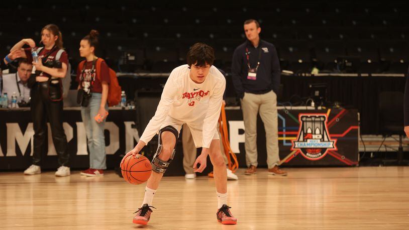 Dayton's Mike Sharavjamts warms up before a game against Saint Joseph’s in the quarterfinals of the Atlantic 10 Conference tournament on Thursday, March 9, 2023, at the Barclays Center in Brooklyn, N.Y. David Jablonski/Staff