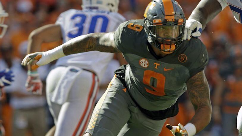 In this Sept. 24, 2016, file photo, Tennessee defensive end Derek Barnett (9) plays against Florida in an NCAA college football game, in Knoxville, Tenn. Barnett was selected to the 2016 AP All-America college football team, Monday, Dec. 12, 2016.  (AP Photo/Wade Payne, File)