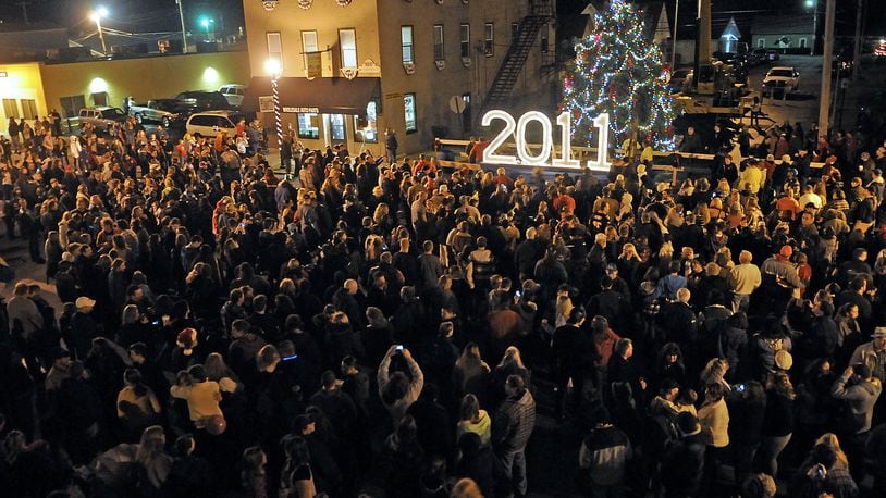 Scenes from past New Carlisle New Year’s Eve Ball Drop events. MARSHALL GORBY / STAFF FILE PHOTO