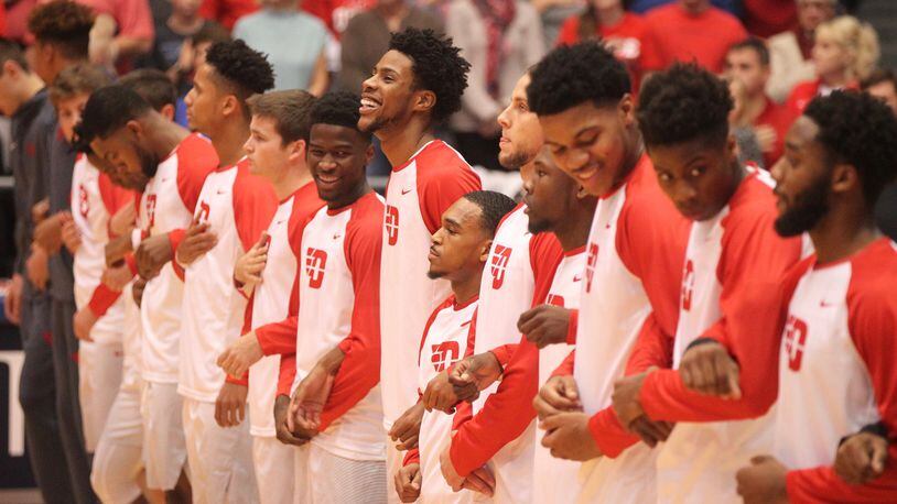 Dayton players stand for the national anthem before a game against Ohio Dominican on Saturday, Nov. 4, 2017, at UD Arena. David Jablonski/Staff