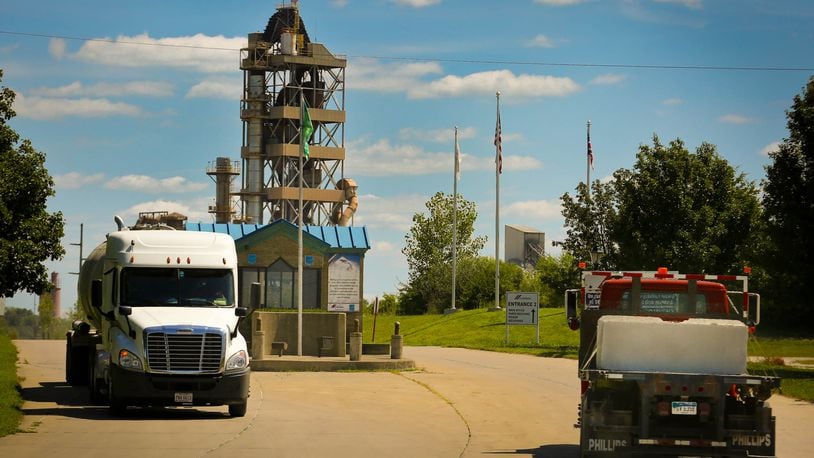 Trucks enter and exit the Cemex plant main entrance on Linebaugh Road